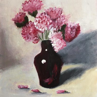 Pink carnations in ruby vase
